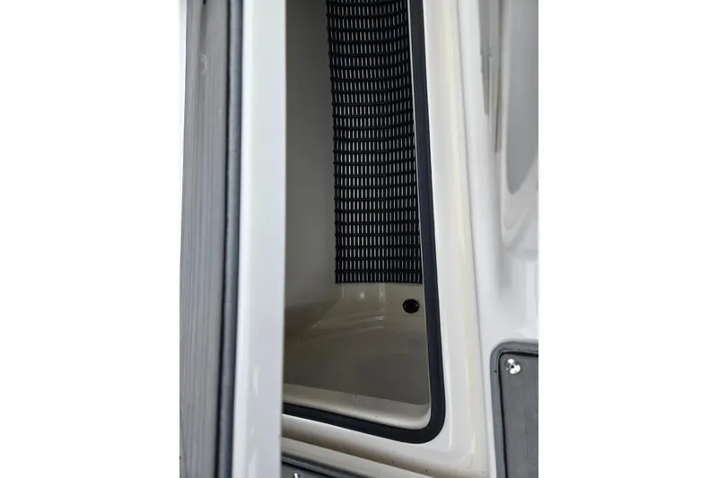 Slide: The Image of Interior view of 2017 Yamaha Boats 212 Limited S, showcasing storage compartment. - 15