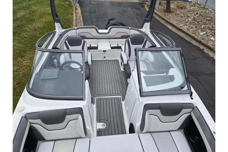 Slide: The Image of 2017 Yamaha Boats 212 Limited S interior with sleek seating and modern dashboard design. - 21