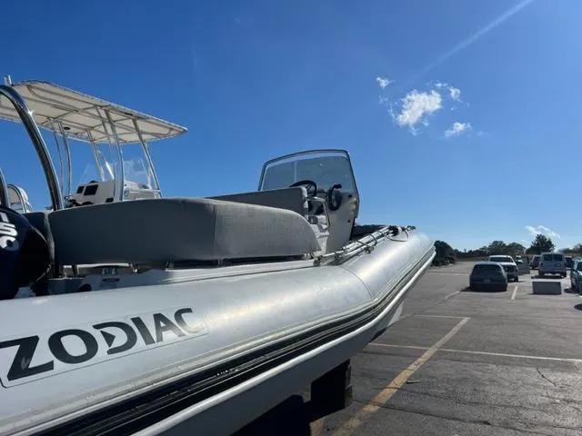 Slide: The Image of 2023 Zodiac N-ZO 680 boat parked under clear blue sky in a parking lot. - 4