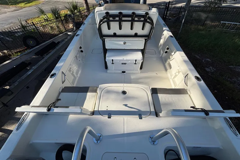 Slide: The Image of 2022 World Cat 235 CC boat interior with seating and storage compartments. - 5