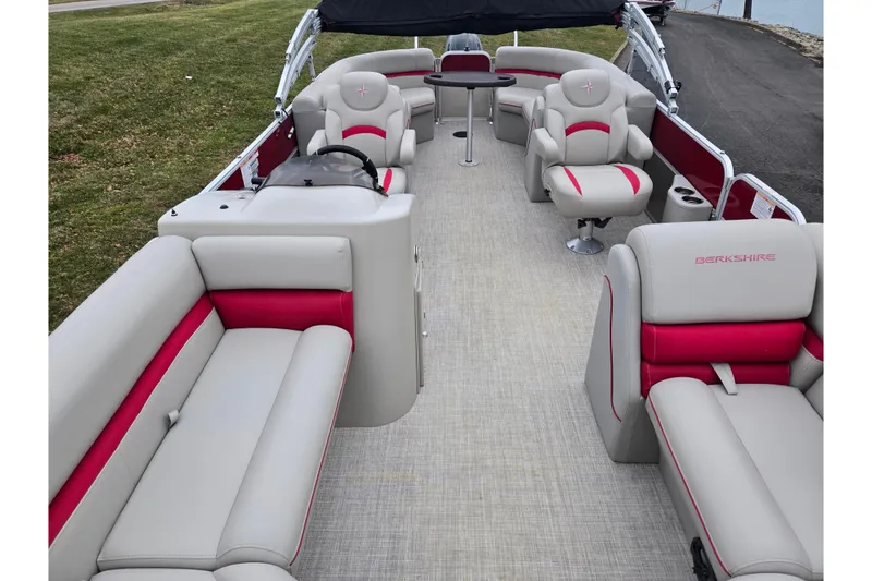 Slide: The Image of 2008 Berkshire CPT 24 RFX pontoon boat with red and gray seating, spacious interior. - 11