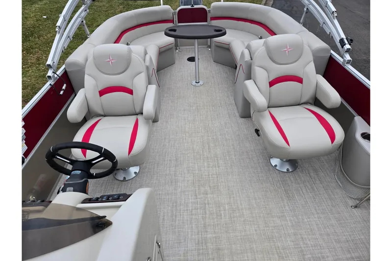 Slide: The Image of Interior of 2008 Berkshire CPT 24 RFX boat with plush seating and steering wheel. - 13