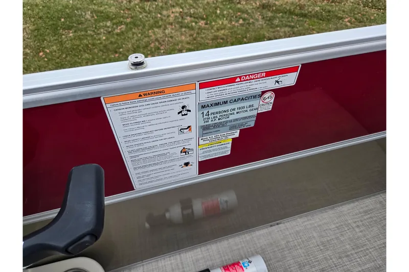 Slide: The Image of Warning and capacity labels on 2008 Berkshire CPT 24 RFX boat railing. - 14