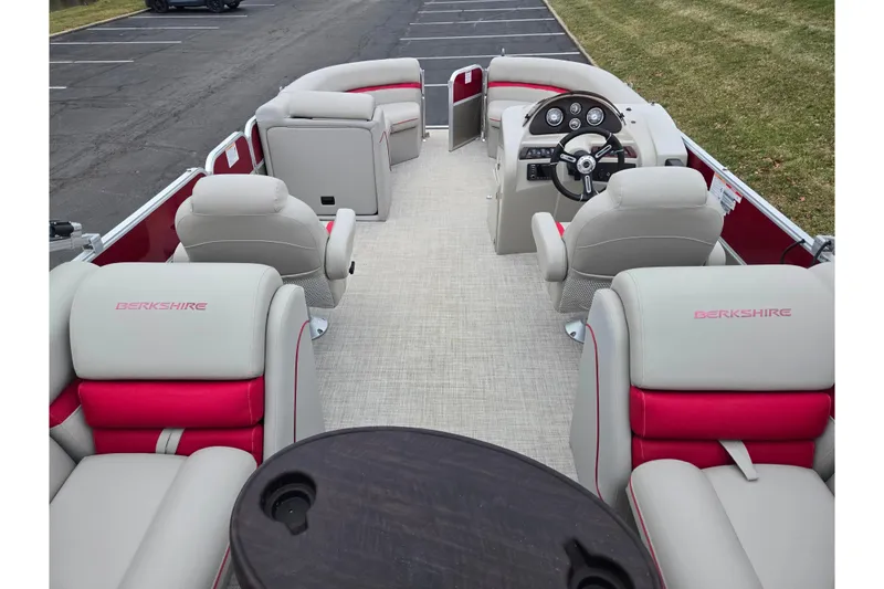 Slide: The Image of 2008 Berkshire CPT 24 RFX pontoon boat interior with plush seating and steering console. - 17