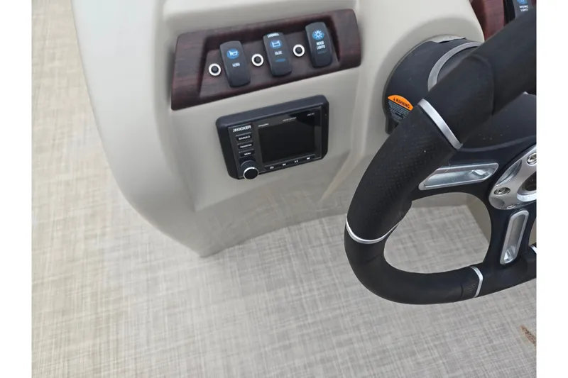Slide: The Image of Steering console of 2008 Berkshire CPT 24 RFX boat with controls and Kicker audio system. - 19