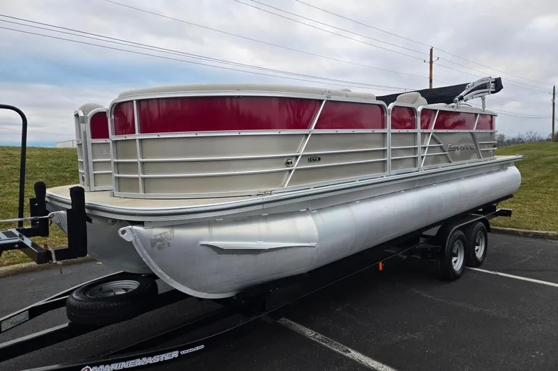 Slide: The Image of 2008 Berkshire CPT 24 RFX pontoon boat on trailer, featuring red and silver design. - 5