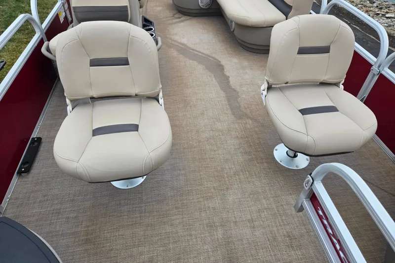 Slide: The Image of 2020 Sun Tracker Bass Buggy 18 DLX interior with beige seats and carpeted floor. - 10