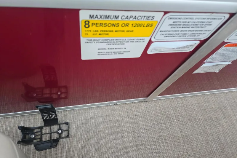 Slide: The Image of 2020 Sun Tracker Bass Buggy 18 DLX capacity label, 8 persons or 1200 lbs limit. - 16