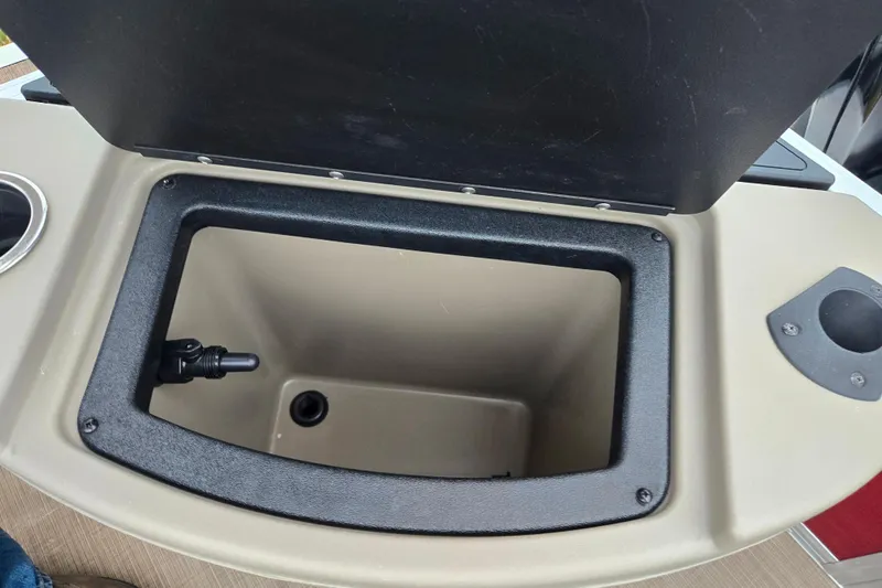 Slide: The Image of Open storage compartment on 2020 Sun Tracker Bass Buggy 18 DLX boat. - 19