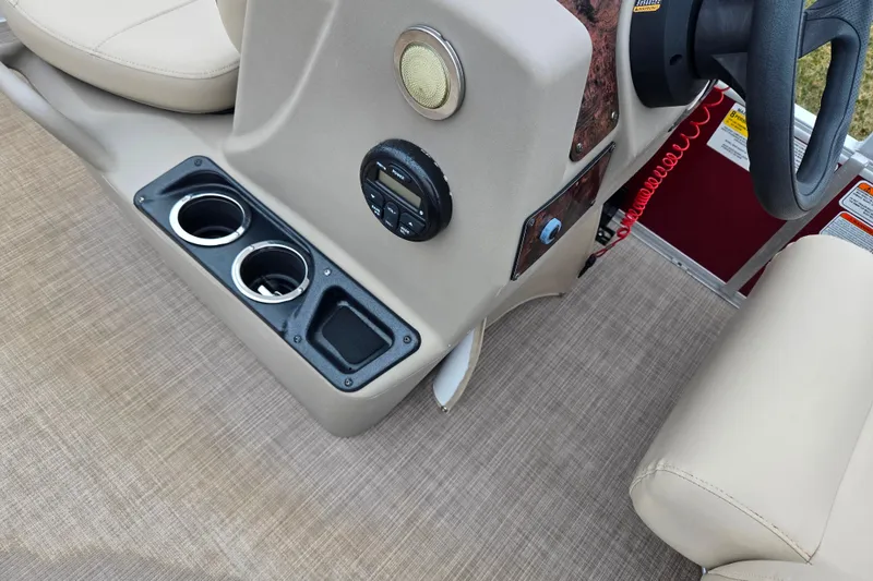 Slide: The Image of 2020 Sun Tracker Bass Buggy 18 DLX console with cup holders and control panel. - 23