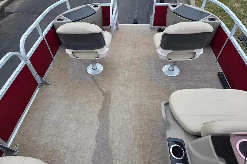 Slide: The Image of 2020 Sun Tracker Bass Buggy 18 DLX pontoon boat interior with seating and console. - 24