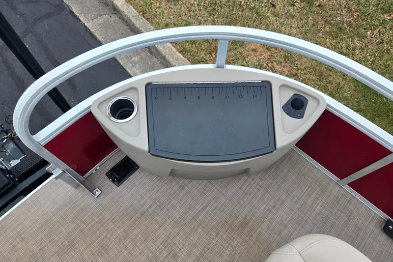 Slide: The Image of 2020 Sun Tracker Bass Buggy 18 DLX boat deck with measuring board and cup holder. - 25