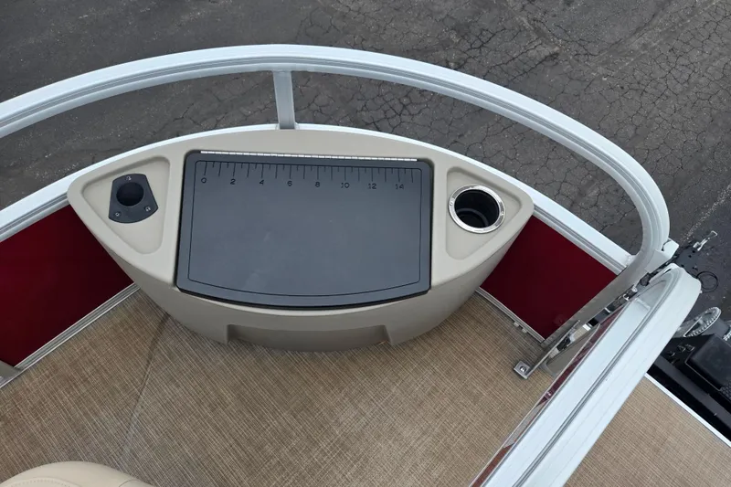 Slide: The Image of 2020 Sun Tracker Bass Buggy 18 DLX boat deck with measuring board and cup holder. - 27