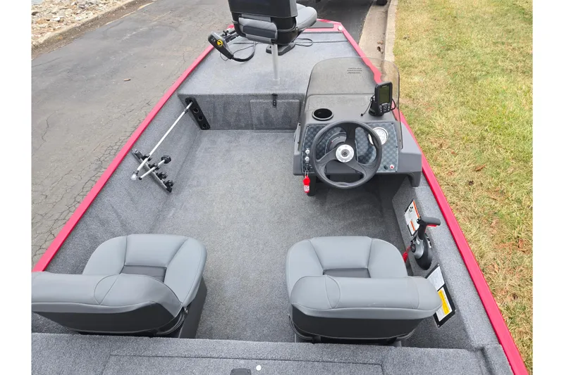 Slide: The Image of 2024 Tracker Bass Tracker Classic XL interior with steering console and seating. - 11