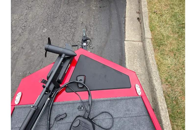 Slide: The Image of 2024 Tracker Bass Tracker Classic XL boat with trolling motor on pavement. - 16