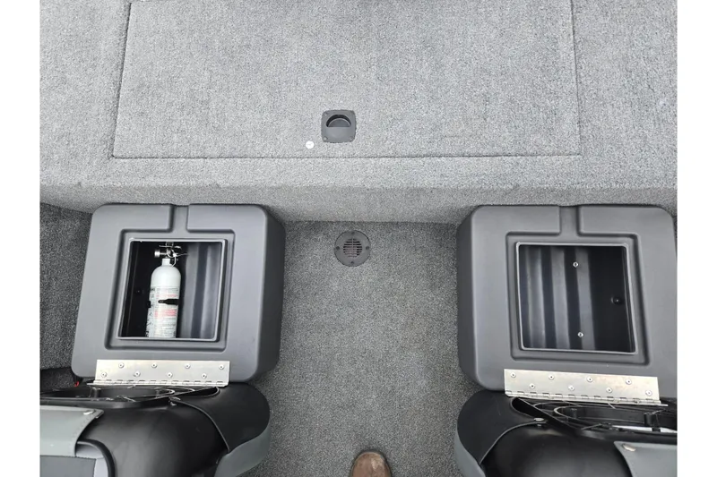 Slide: The Image of 2024 Tracker Bass Tracker Classic XL boat interior with storage compartments and fire extinguisher. - 21