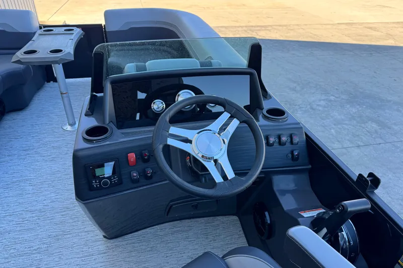 Slide: The Image of 2026 Bennington 22 SSR boat dashboard with steering wheel and control panel. - 12
