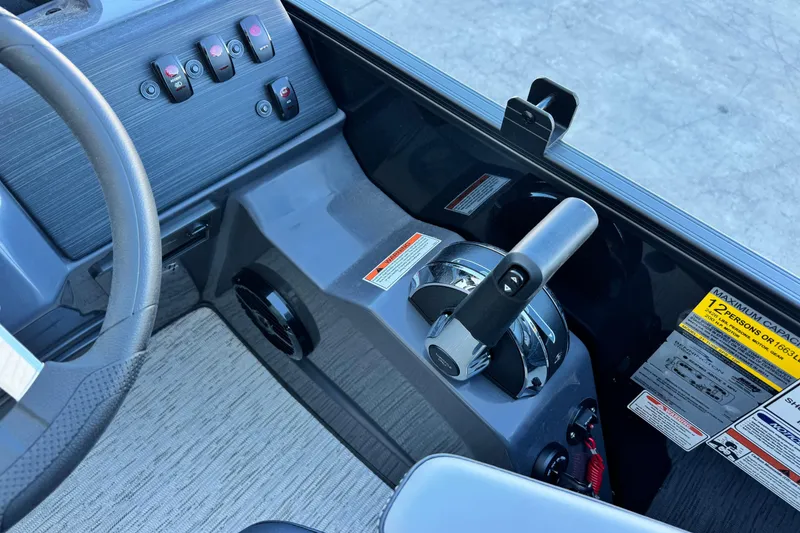 Slide: The Image of 2026 Bennington 22 SSR boat dashboard with steering wheel and control panel. - 13