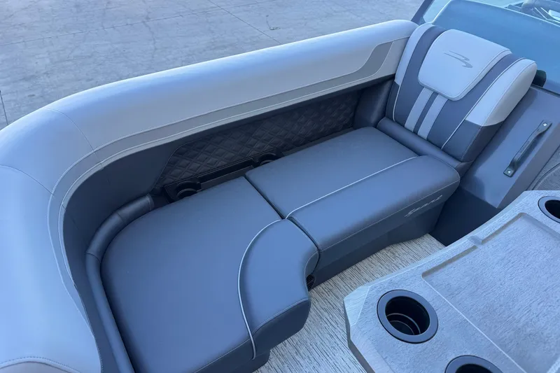 Slide: The Image of 2026 Bennington 22 SSR boat interior with luxurious gray seating and cup holders. - 19