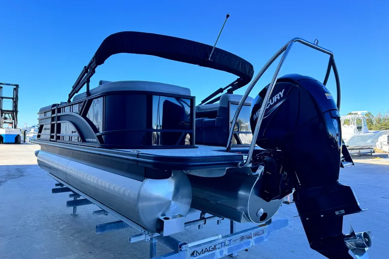 Slide: The Image of 2026 Bennington 22 SSR pontoon boat with Mercury outboard engine on trailer. - 5