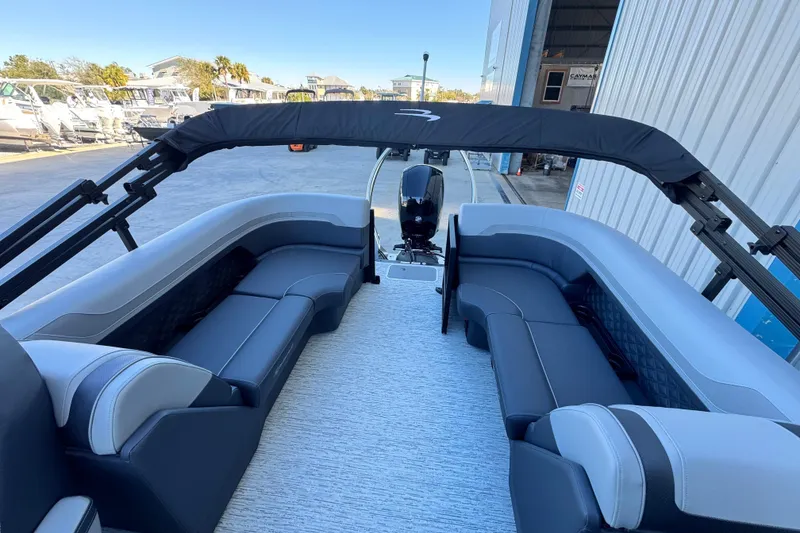 Slide: The Image of 2026 Bennington 22 SSR pontoon boat interior with plush seating and modern design. - 9