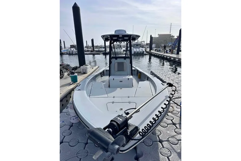 The Image of 2023 BlackJack 256 Bay boat docked at marina, featuring sleek design and modern equipment. - 1