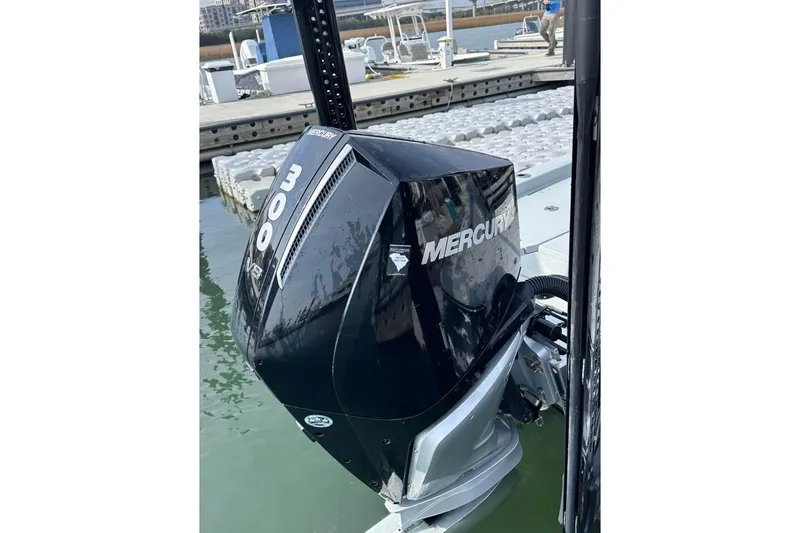 Slide: The Image of 2023 BlackJack 256 Bay boat with Mercury 300 V8 engine at dock. - 5