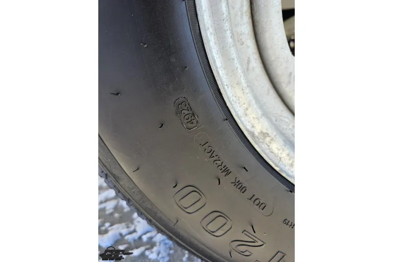 Slide: The Image of Close-up of a Cobalt 293 tire from the year 2000, showing tread details. - 10