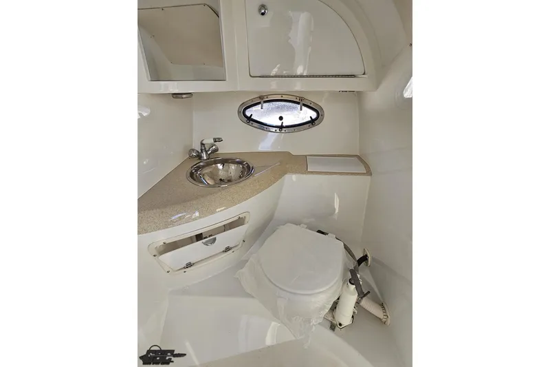 Slide: The Image of Interior of a 2000 Cobalt 293 boat bathroom with sink and toilet. - 100