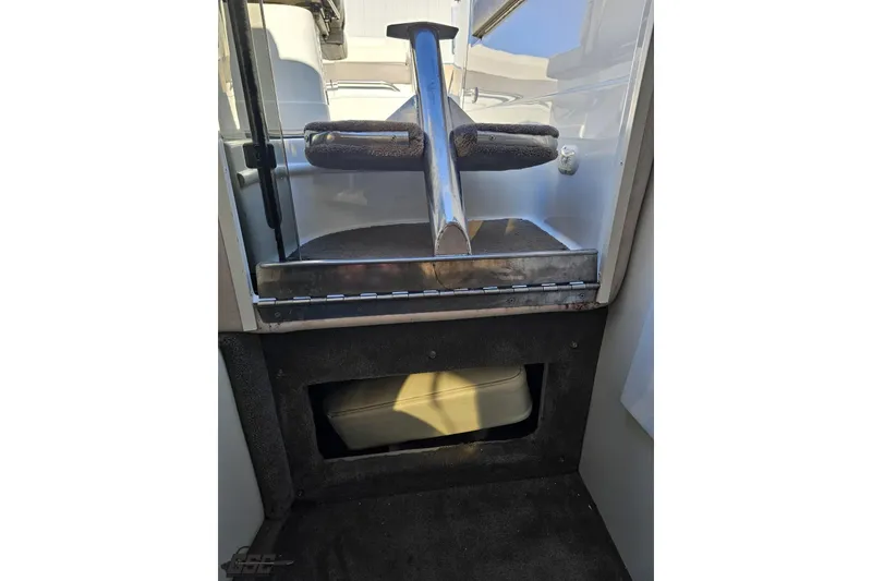 Slide: The Image of Interior view of a 2000 Cobalt 293 boat, featuring a step and storage area. - 101