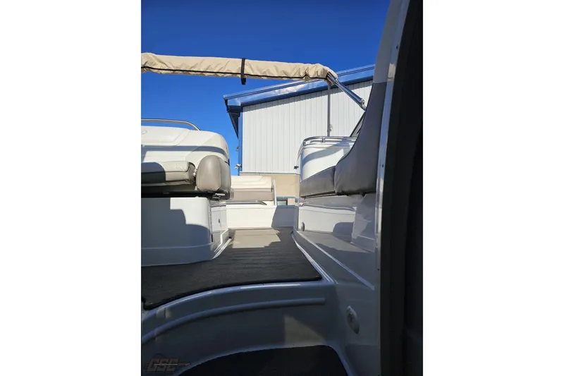 Slide: The Image of Interior view of a 2000 Cobalt 293 boat with seating and canopy. - 103