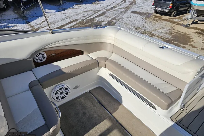 Slide: The Image of Interior of a 2000 Cobalt 293 boat with beige seating and speaker system. - 108
