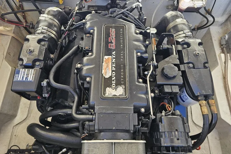 Slide: The Image of Engine of a 2000 Cobalt 293 boat, featuring Volvo Penta 8.2 GSi electronic fuel injection. - 113