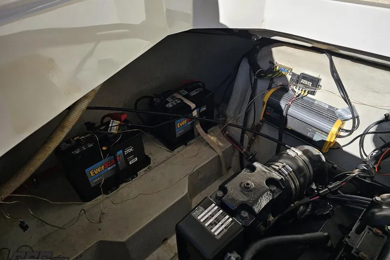 Slide: The Image of Engine compartment of a 2000 Cobalt 293 boat with EverStart batteries and wiring. - 114
