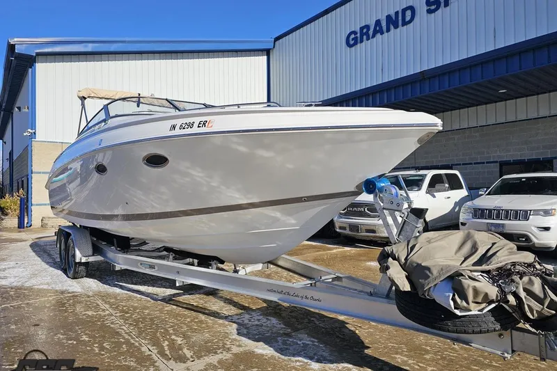 Slide: The Image of 2000 Cobalt 293 boat on trailer outside Grand Sports building. - 12