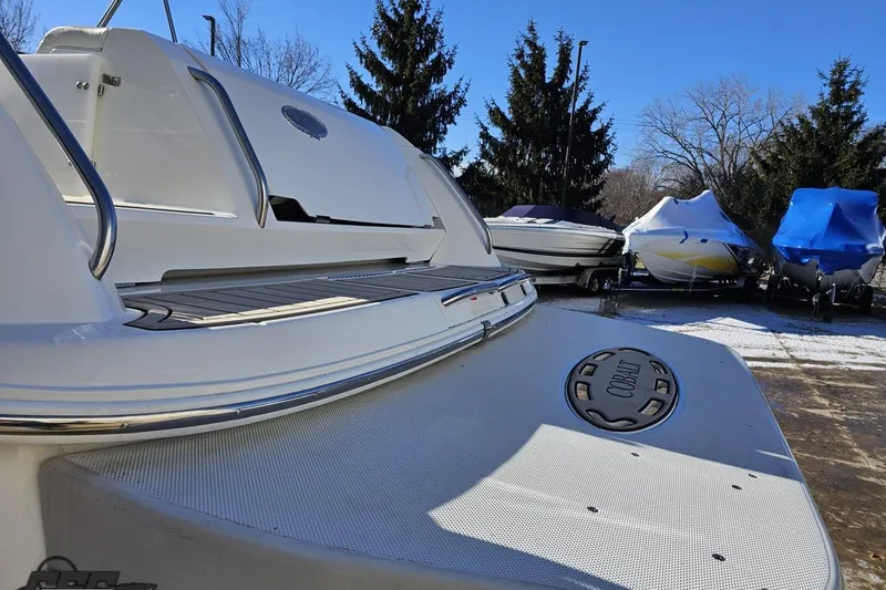 Slide: The Image of Rear view of a 2000 Cobalt 293 boat with a spacious swim platform. - 23