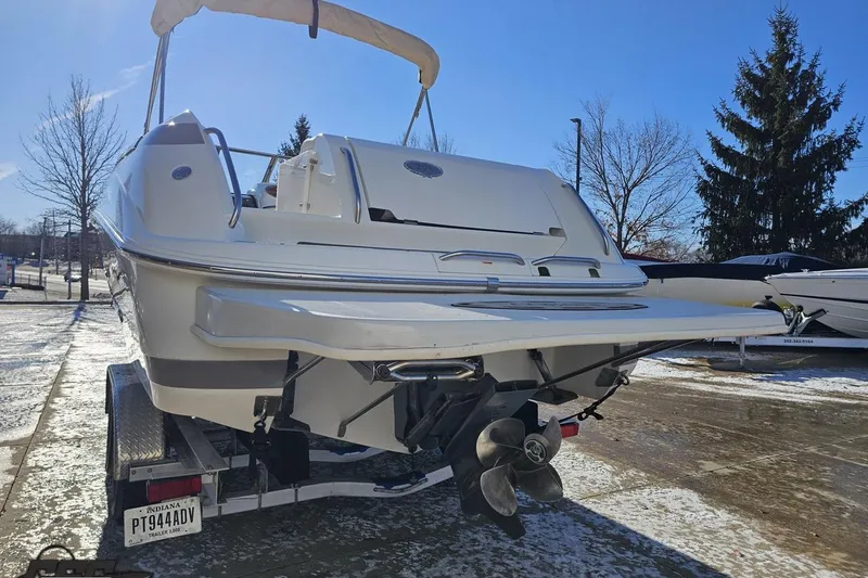Slide: The Image of Cobalt 293 boat from 2000 on trailer, rear view, sunny day. - 24