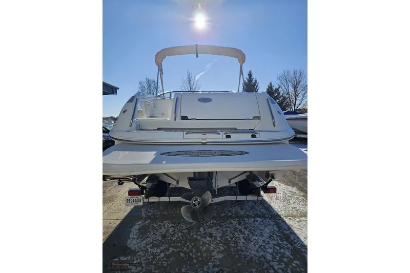 Slide: The Image of Rear view of a 2000 Cobalt 293 boat under clear blue sky. - 26