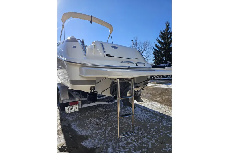 Slide: The Image of 2000 Cobalt 293 boat with ladder on trailer in snowy setting. - 28
