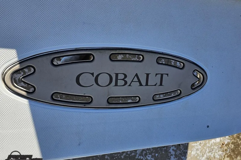 Slide: The Image of Cobalt 293 emblem on a 2000 model boat, metallic finish. - 31