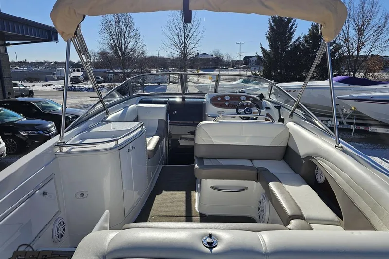Slide: The Image of Interior view of a 2000 Cobalt 293 boat with seating and steering wheel. - 37
