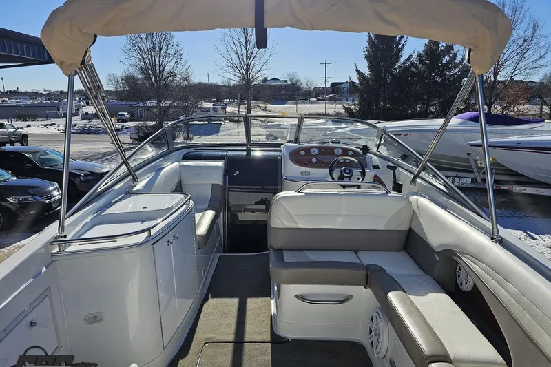 Slide: The Image of Interior view of a 2000 Cobalt 293 boat with seating and steering wheel. - 38