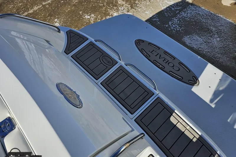 Slide: The Image of Rear deck of a 2000 Cobalt 293 boat with logo and non-slip surface. - 41