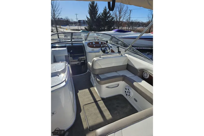 Slide: The Image of Interior of a 2000 Cobalt 293 boat with seating and steering wheel. - 42