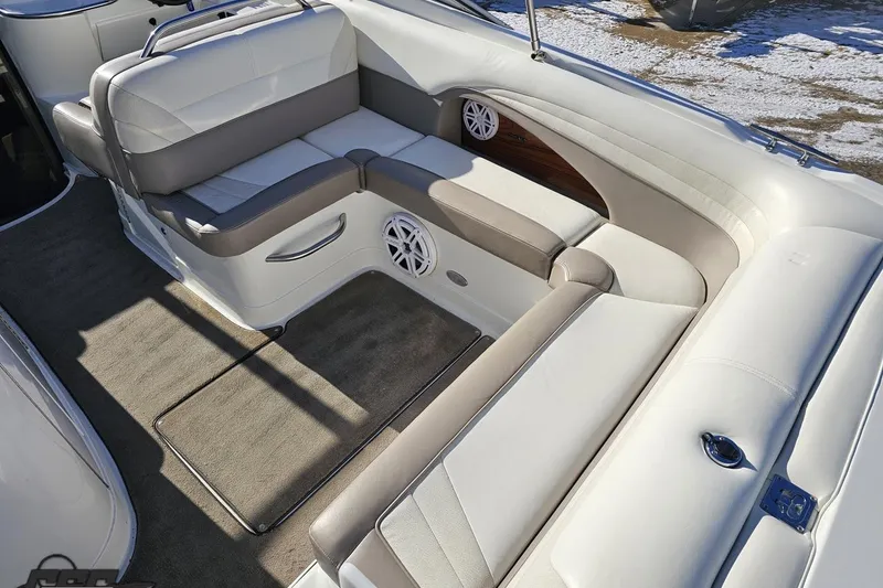Slide: The Image of Interior of a 2000 Cobalt 293 boat with white and gray seating. - 44