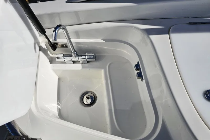Slide: The Image of Boat sink with chrome faucet on 2000 Cobalt 293 model. - 51