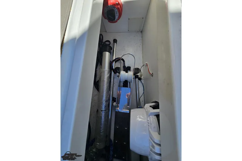 Slide: The Image of Engine compartment of a 2000 Cobalt 293 boat, showing mechanical components. - 55