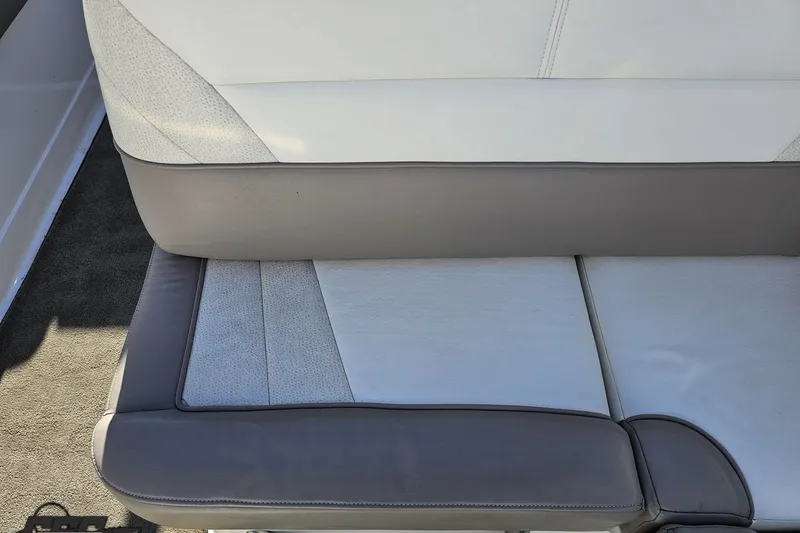 Slide: The Image of Cobalt 293 boat seat, 2000 model, featuring gray and white upholstery. - 56