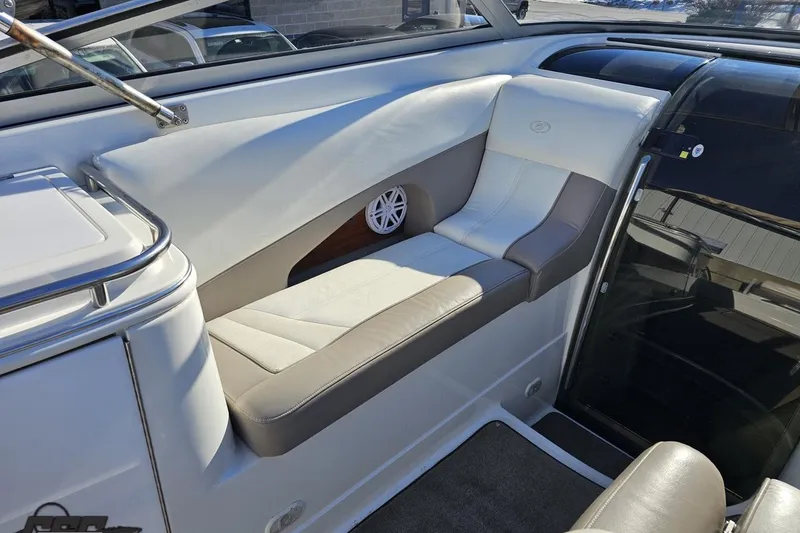 Slide: The Image of Interior seating of a 2000 Cobalt 293 boat with white and beige upholstery. - 59