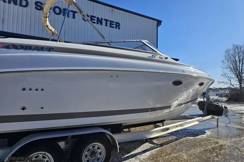 Slide: The Image of 2000 Cobalt 293 boat on trailer at a sport center, side view. - 6